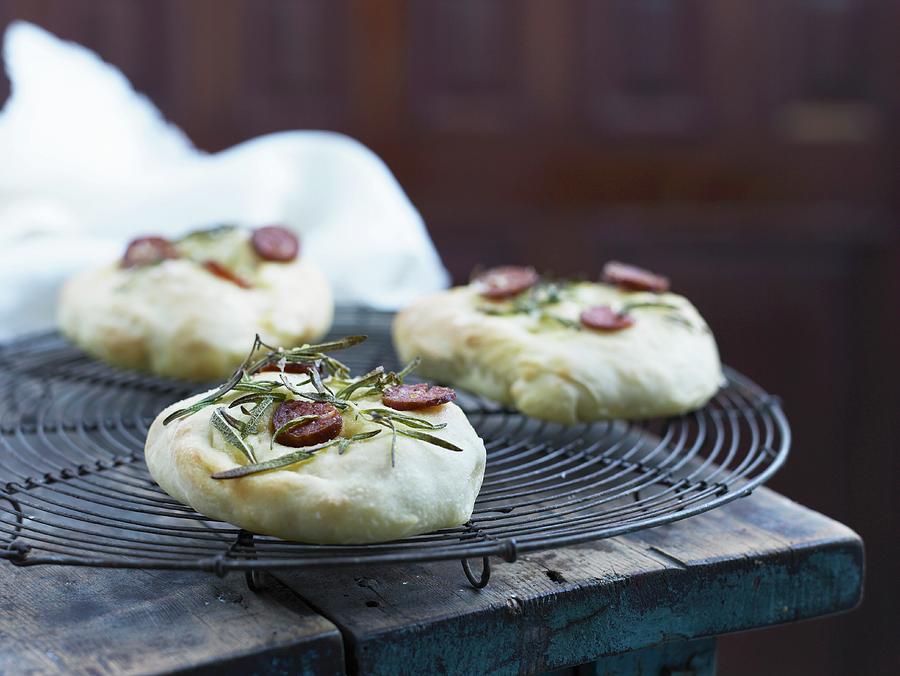 Mini Pizzas With Rosemary And Chorizo Photograph by Mikkel Adsbl