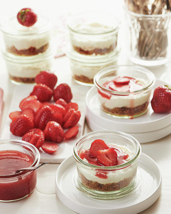 Mini Strawberry Cheesecakes In Glasses With An Amarettini Base Photograph by Hannah Kompanik