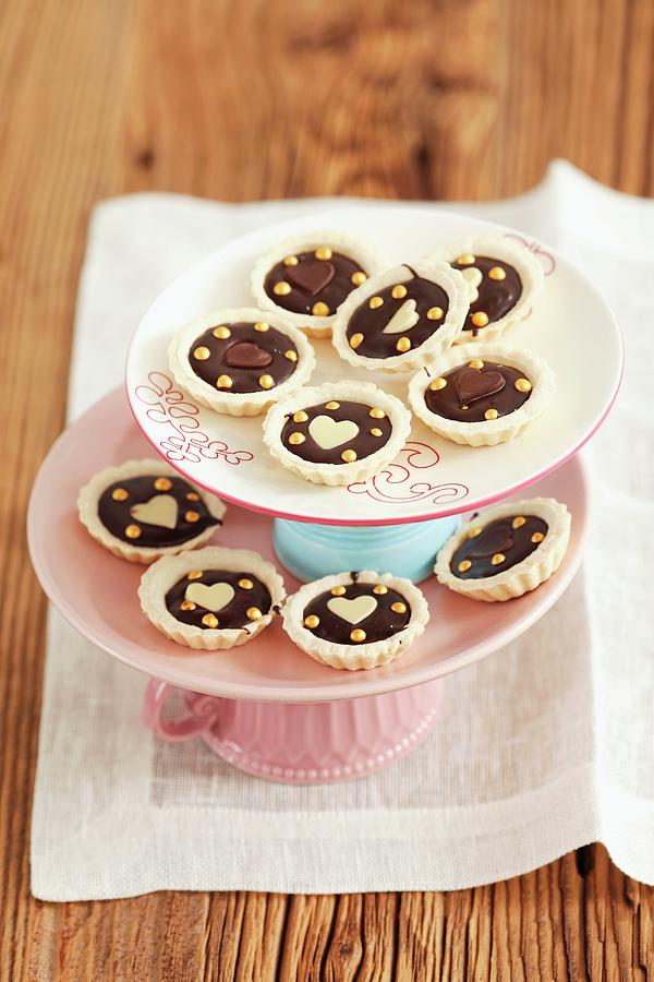 Mini Tartlets With Chocolate, On A Tiered Cake Stand Photograph by Rua Castilho