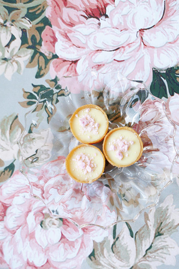 Mini Tarts Filled With Cream And Pink Meringues On A Glass Plate top View Photograph by Viola Cajo