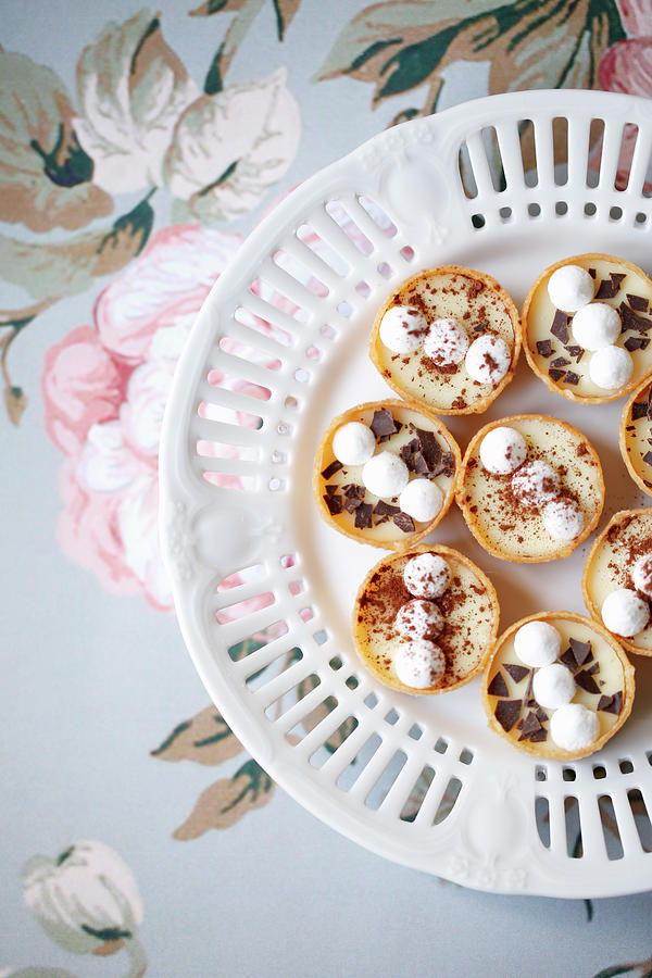 Mini Tarts Filled With Cream, Meringue, Chocolate Chips And Cocoa top View Photograph by Viola Cajo
