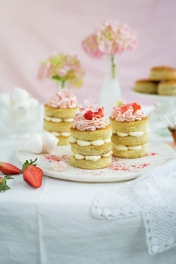 Mini Vanilla Cakes With Pink Frosting For Afternoon Tea Photograph by Lucy Parissi