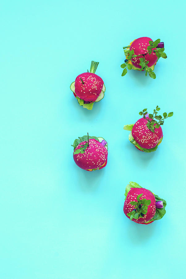 Mini Vegan Burgers With Beetroot, Carrots And Lettuce On A Blue Surface Photograph by Gorobina