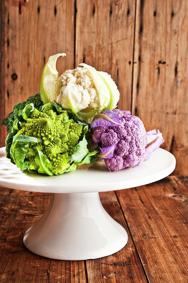 Mini Vegetables cauliflower, Romanesco Broccoli On A Cake Stand Photograph by Atelier Hmmerle
