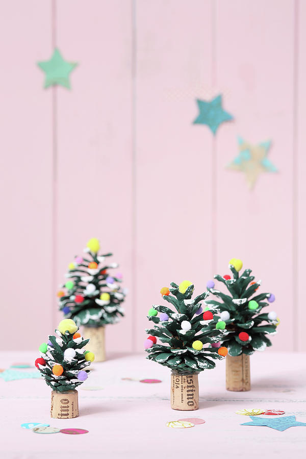 Miniature Christmas Trees Made From Painted Pine Cones Decorated With Pompoms Photograph by Thordis Rggeberg