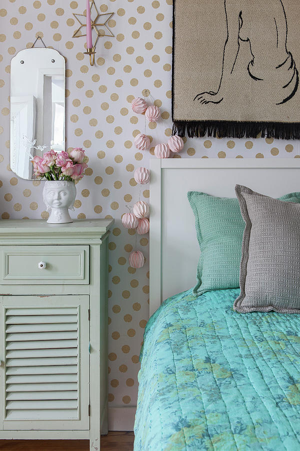 Mint-green Bedside Cabinet And Bed Against Polka-dot Wallpaper Photograph by Anne-catherine Scoffoni