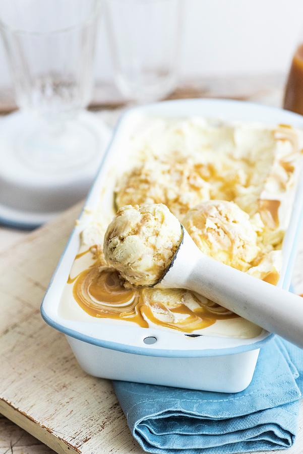 Miso & Butterscotch Ice Cream With An Ice Cream Scoop Photograph by Hein Van Tonder