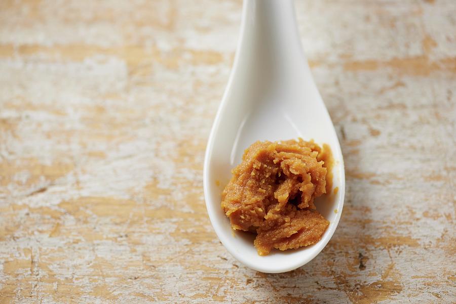 Miso Paste On A Ceramic Spoon Ready To Add To A Recipe Photograph by Amanda Stockley