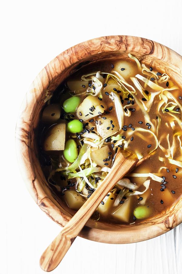 Miso Soup With Potatoes, White Cabbage And Soya Beans Photograph by Sarah Coghill