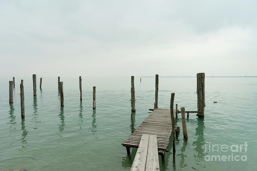 Misty Morning Lake Garda Photograph by Ann Garrett