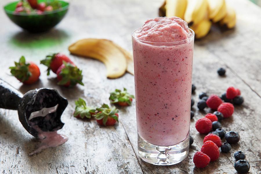 Mixed Fruit Smoothie With Bananas, Strawberies, Rasberries And Bluberries Photograph by Andr Ainsworth