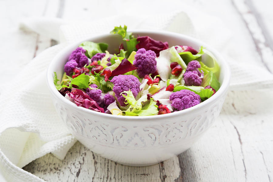 Mixed Leaf Salad With Purple Cauliflower, Avocado And Pomegranate Seeds Photograph by Larissa Veronesi