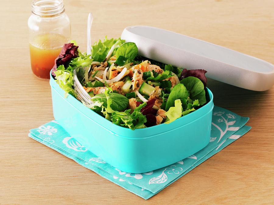 Mixed Leaf Salad With Smoked Salmon In A Lunch Box With A Jar Of Dressing Photograph by Frank Adam