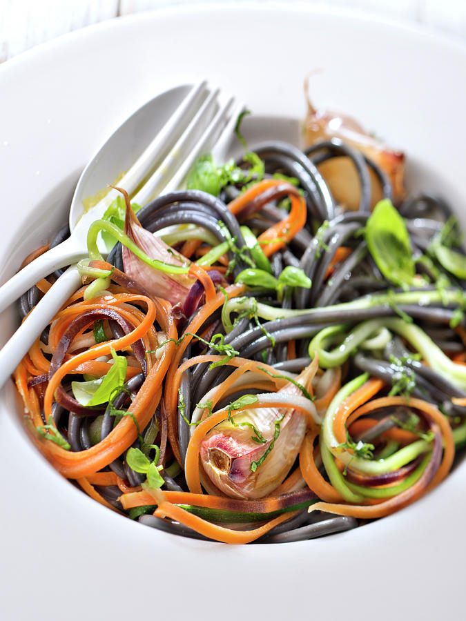 Mixed Squid Ink And Vegetable Spaghettis With Garlic And Basil Photograph by Studio