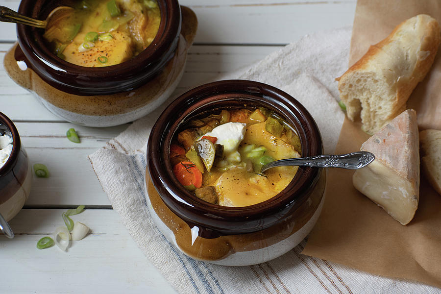 Mixed Vegetable Soup Served In Clay Pots, Topped With Grilled Cheese And Bread Toast Photograph by Adelina