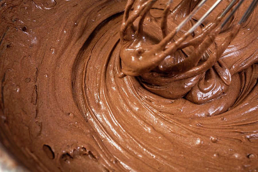 Mixing Cake Batter For A Chocolate Cake Photograph by Herbert Lehmann