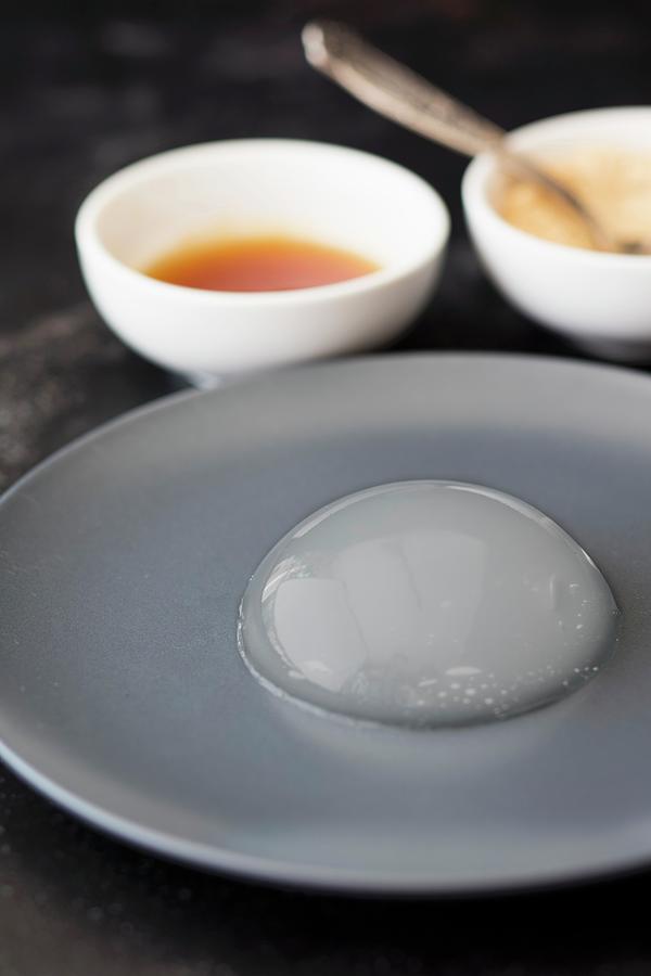 Mizu Shingen Mochi japanese Raindrop Cake On A Grey Plate Photograph by Jan Wischnewski