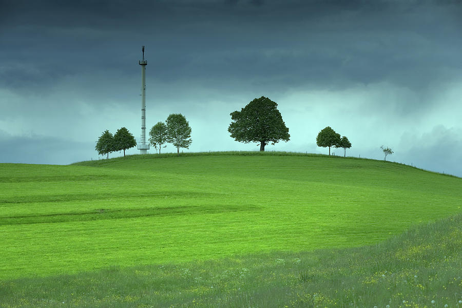 Mobile Phone Antennae On A Green Field Photograph by Bkindler