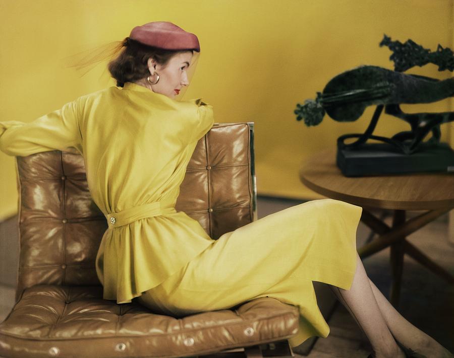 Model In A Yellow Dress Ensemble Photograph by Horst P. Horst
