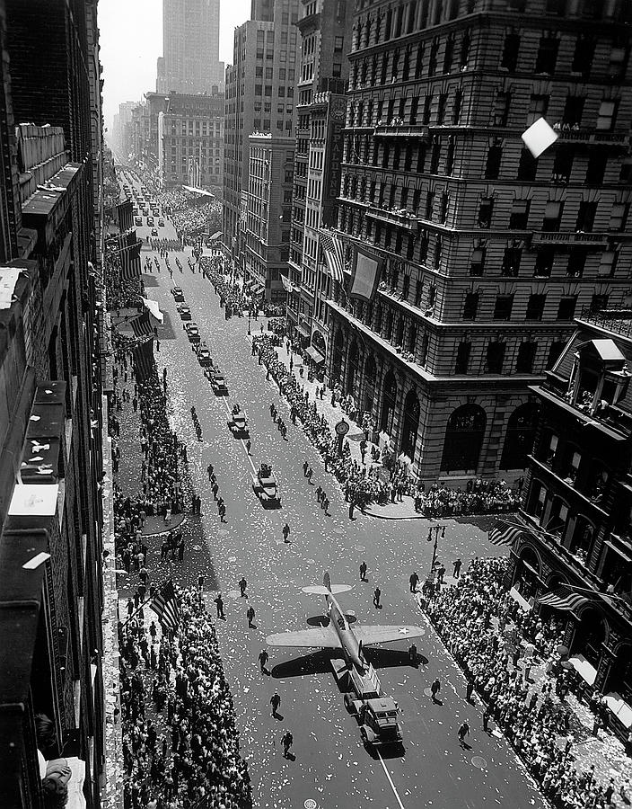 Model of plane on float in New York at War Independence Day parade up Fifth Avenue. Photograph by Andreas Feininger
