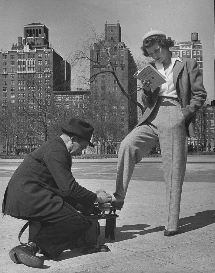 Model Showing Off Slacks As She Reads A Photograph by Nina Leen Model Showing Off Slacks As She Reads A Photograph by Nina Leen