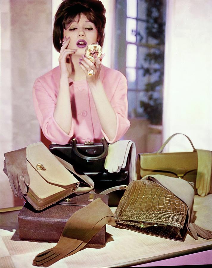 Model Using A Compact By Handbags Photograph by Horst P. Horst