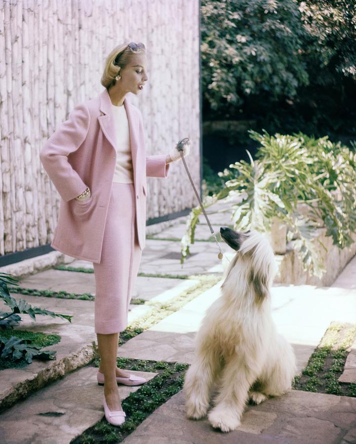 Model With An Afghan Hound Photograph by Clifford Coffin