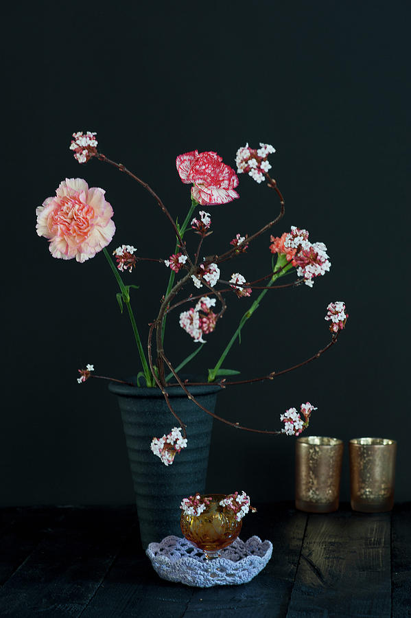 Modern Arrangement Of Carnations And Branches Of Laurustinus Flowers With Leaves Removed Photograph by Elisabeth Berkau