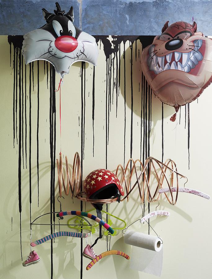 Modern Coat Rack With Various Coathangers Decorated With Cartoon Character Foil Balloons Photograph by Matteo Manduzio