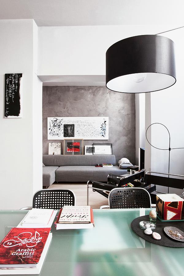 Modern, Open-plan Interior With Designer Furniture And Calligraphy On Walls Photograph by Fabio Lombrici