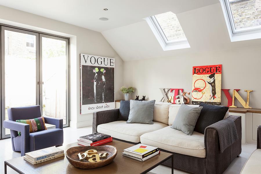 Modern Seating Group In An Attic Room With Decorative Posters Photograph by Simon Maxwell Photography