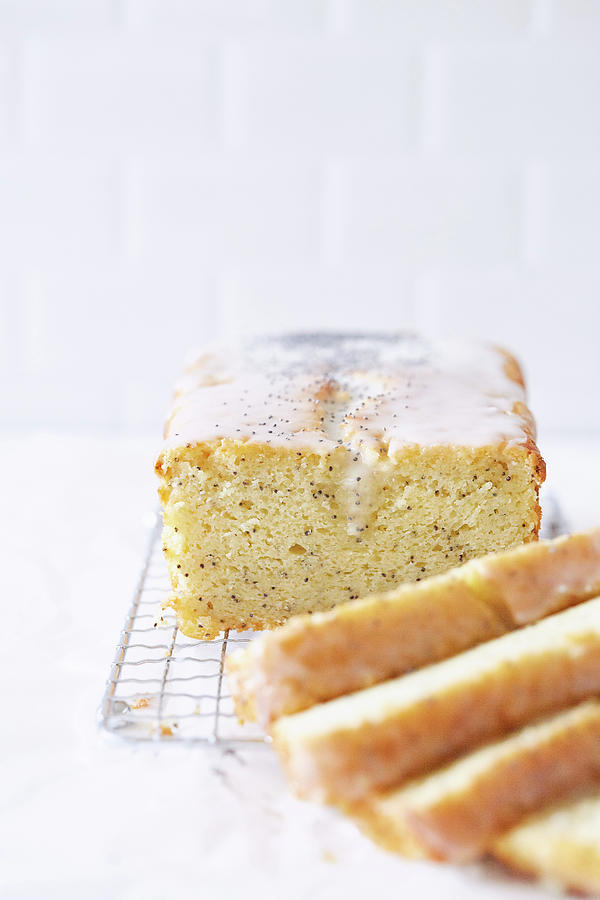 Moist Poppyseed And Lemon Cake With Icing, Sliced Photograph by Theveggiekitchen