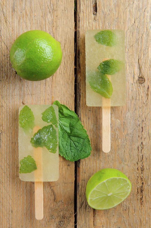 Mojito Ice Lollies On A Wooden Surface Photograph by Jalag / Intosite Kitchengirls