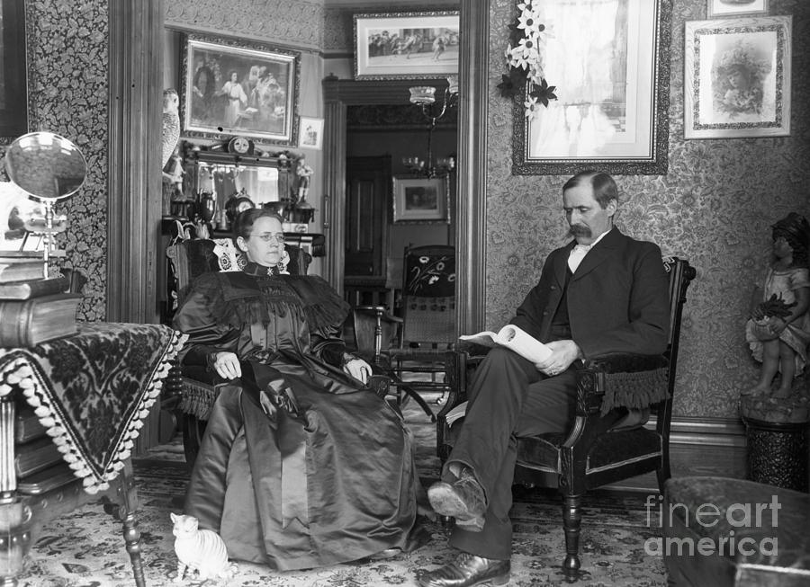 Mom And Pop Seated In Living Room by Bettmann