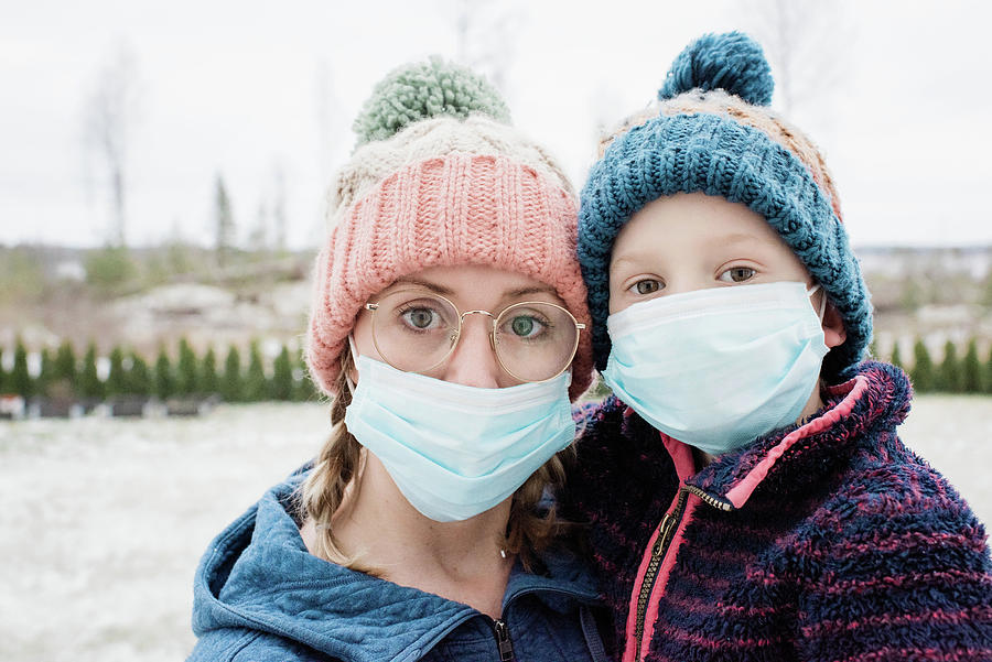 Winter Photograph - Mom And Son Wearing A Face Mask As Protection From Virus And Flu by Cavan Images