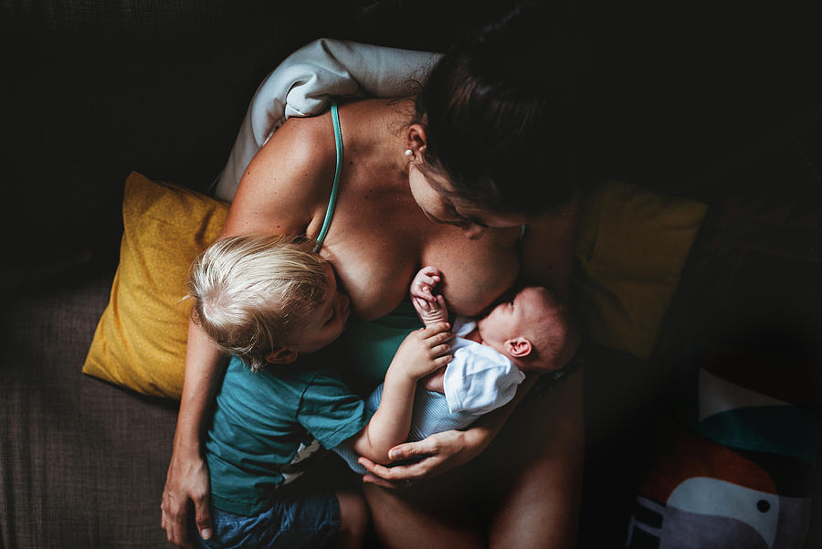 Mom Tandem Breastfeeding Newborn Baby And Toddler Photograph by Cavan Images Mom Tandem Breastfeeding Newborn Baby And Toddler Photograph by Cavan Images