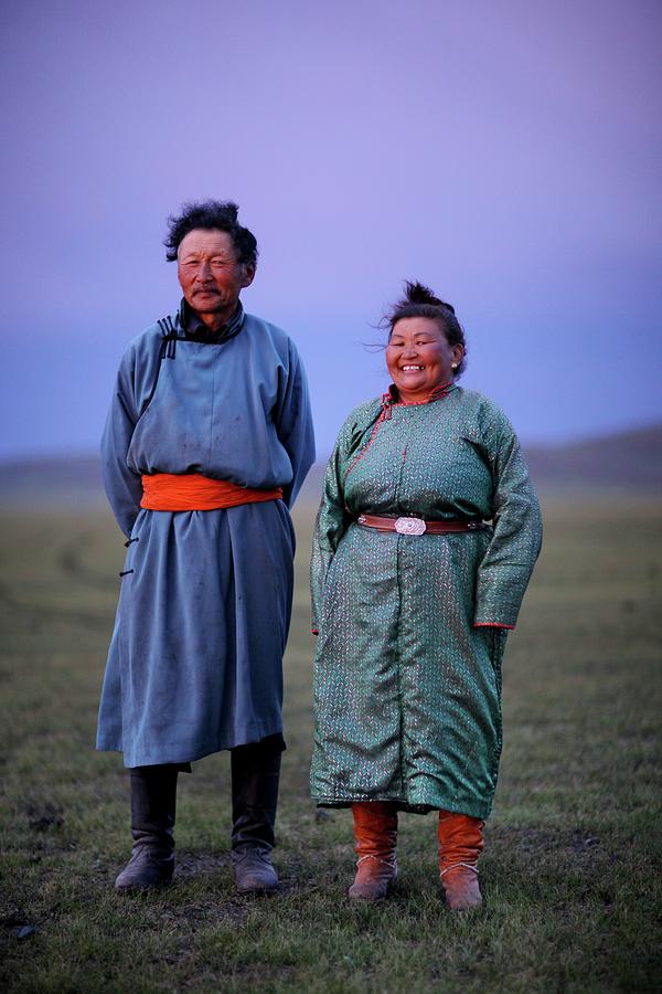 Mongolian Nomadic Couple At Dusk Photograph by Timothy Allen
