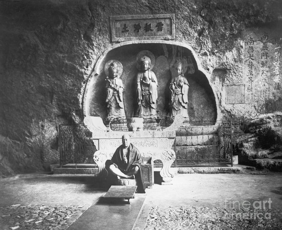 Monk With Buddhist Statues Photograph by Bettmann