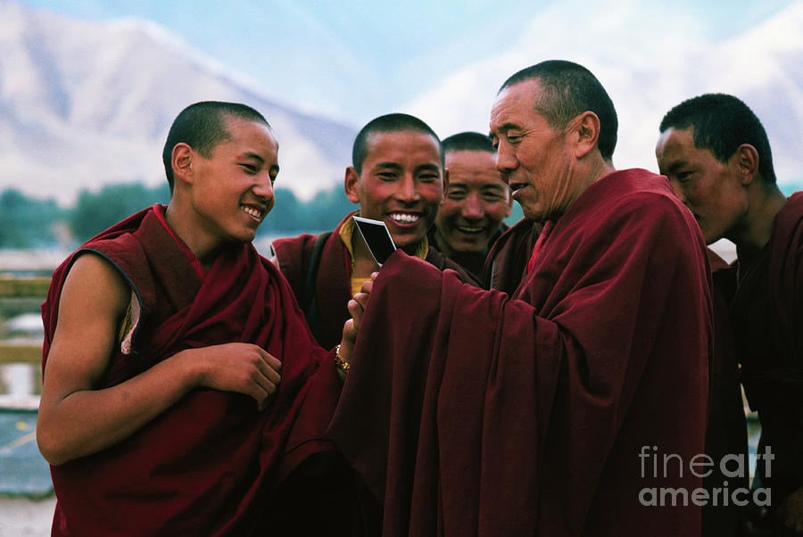 Monks Examining Polaroid Photo Photograph by Bettmann