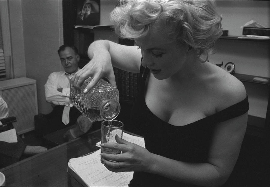 Marilyn Monroe Photograph - Monroe Pouring a Drink by Robert Kelley