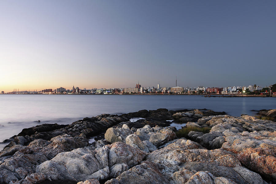 Landscape Photograph - Montevideo City Scape With Rocks At The by Lucop