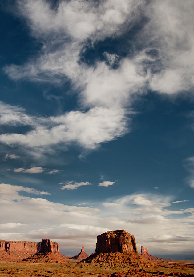 Monument Valley With Dramatic Clouds Photograph by Russell Burden