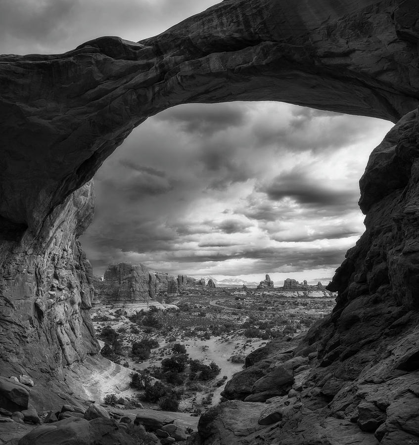 Moody Day At Double Arch Photograph by Owen Weber
