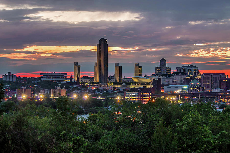 Moody sunset behind the Albany skyline... Photograph by Jay Smith
