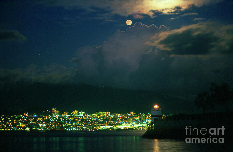 Moon At Night Emerging From A Cloud Over A City Photograph by David ...