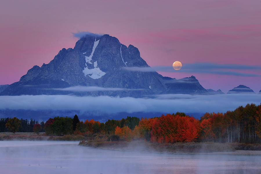 Moonset during sunrise at Mount Moran during autumn Photograph by Jetson Nguyen