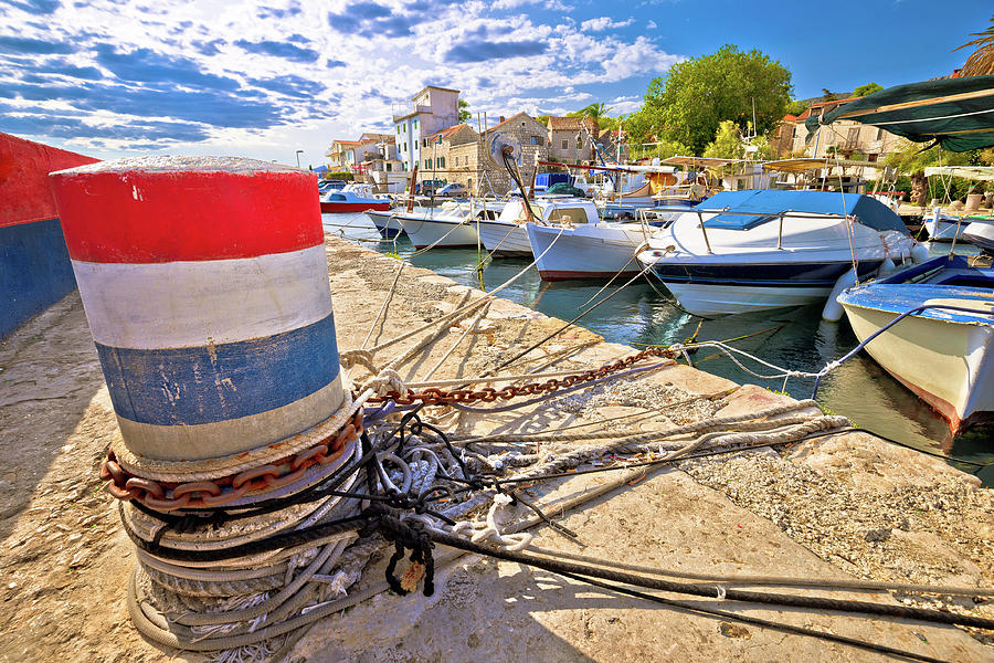 Mooring bollard and old boats in Kastela harbor Photograph by Brch Photography