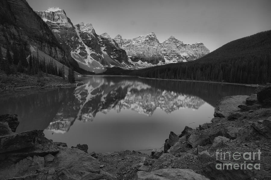 Moraine Lake Sunrise Framed By The Lakeshore Black And White Photograph by Adam Jewell