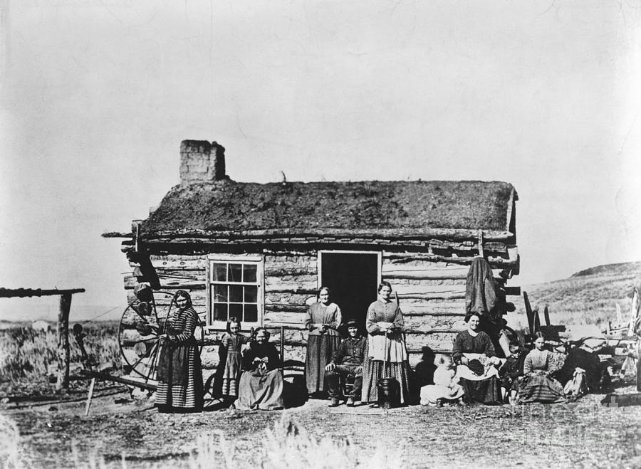 Mormon Family Outside Log Cabin Photograph by Bettmann