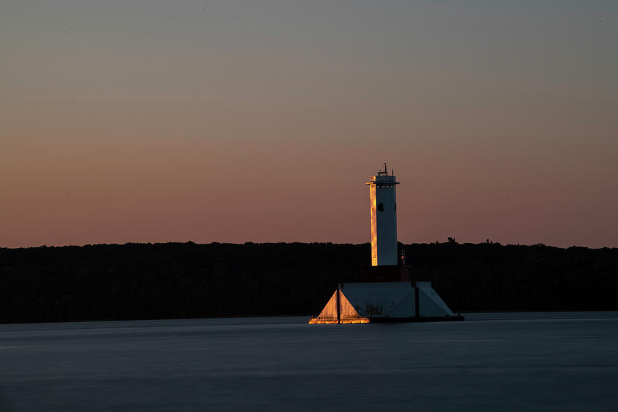 Morning light on the lighthouse Photograph by Dan Friend